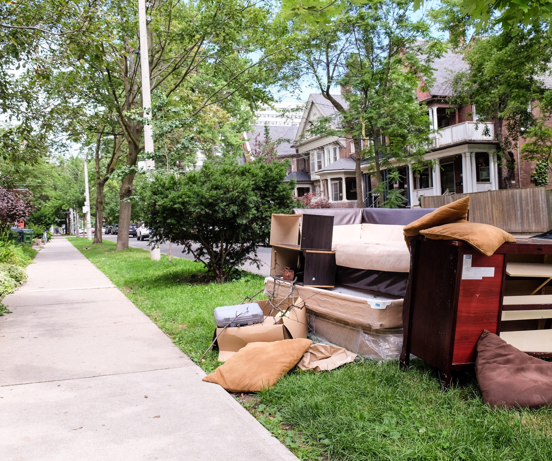 A pile of furniture by the side of the road
